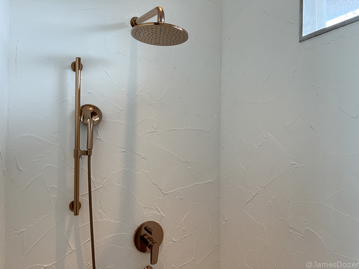 a shower head in a bathroom