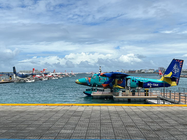 a blue plane on the water