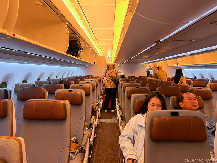 a group of people sitting in an airplane