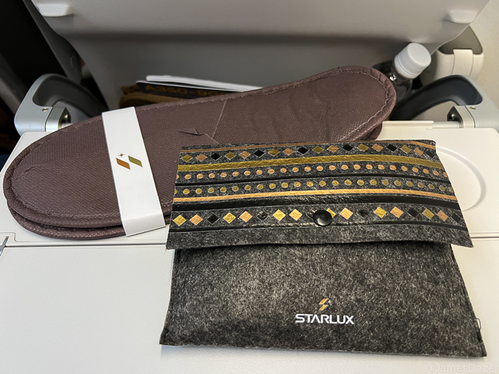 a pair of slippers and a bag on a table