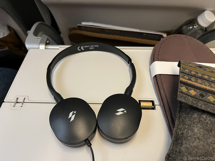 a pair of headphones on a white surface