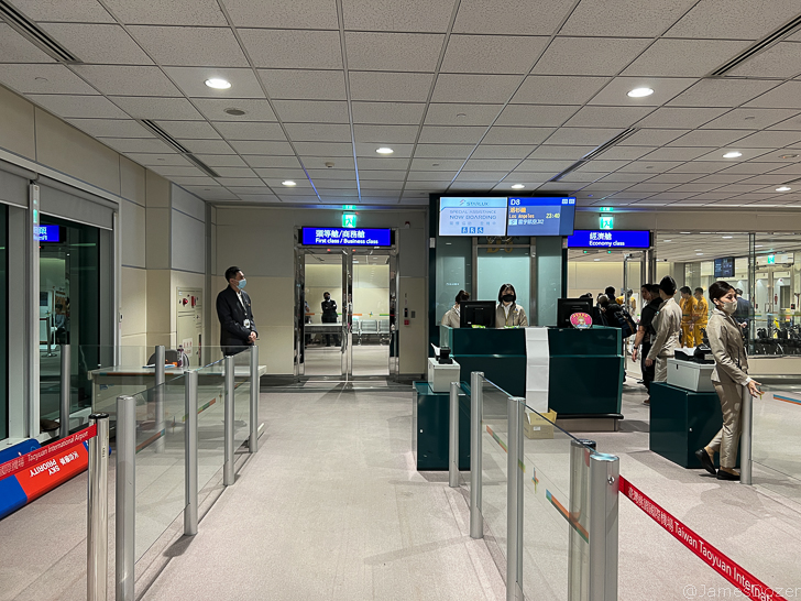 people standing in a line in a building