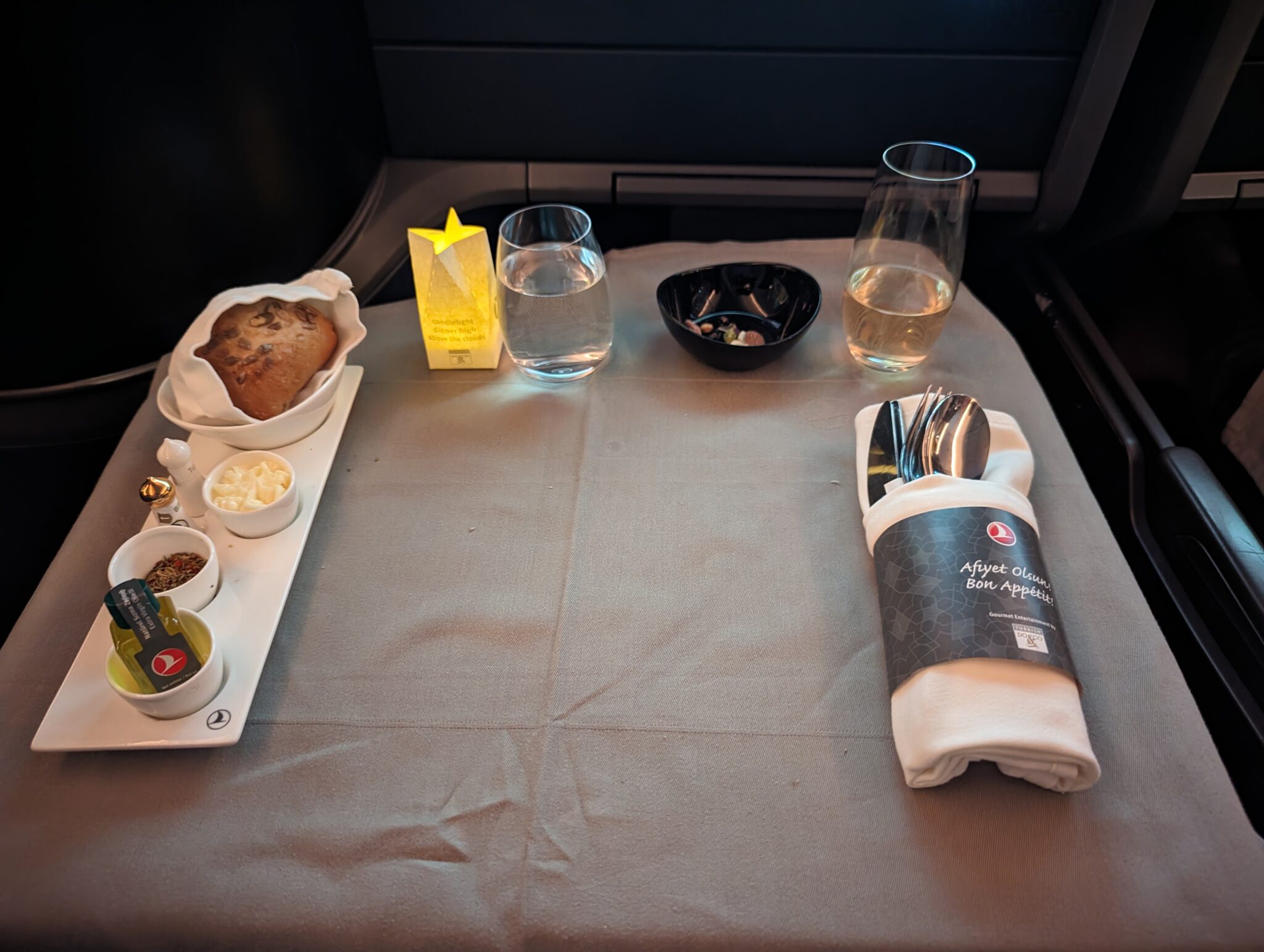 a tray of food and glasses on a table