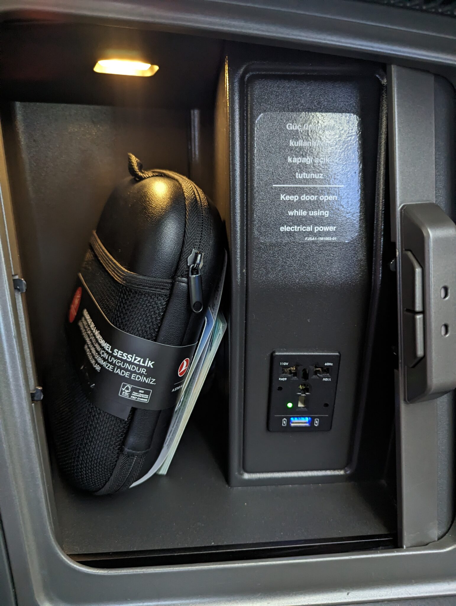 a black case with a cord plug in it