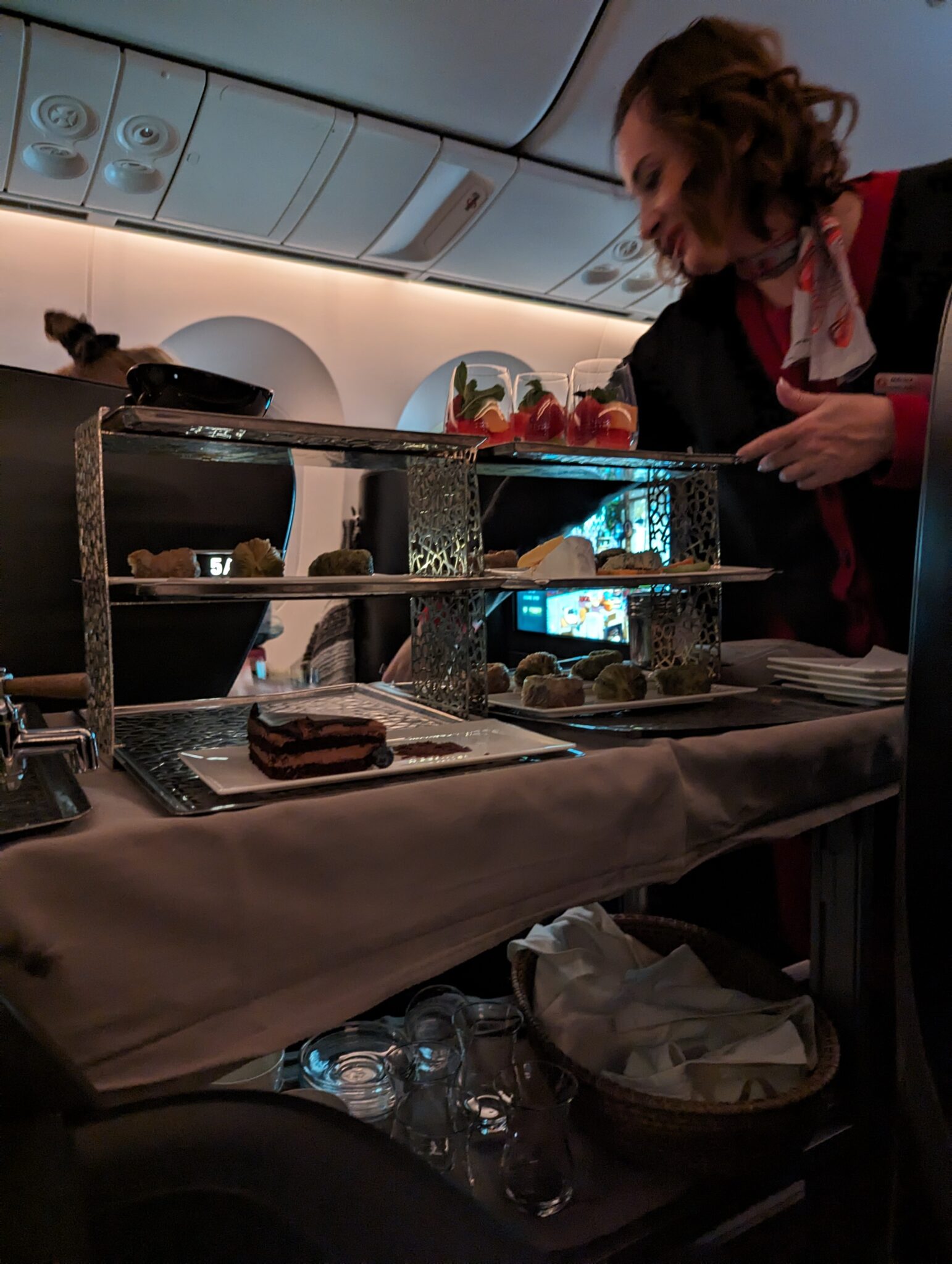 a woman serving food on a tray