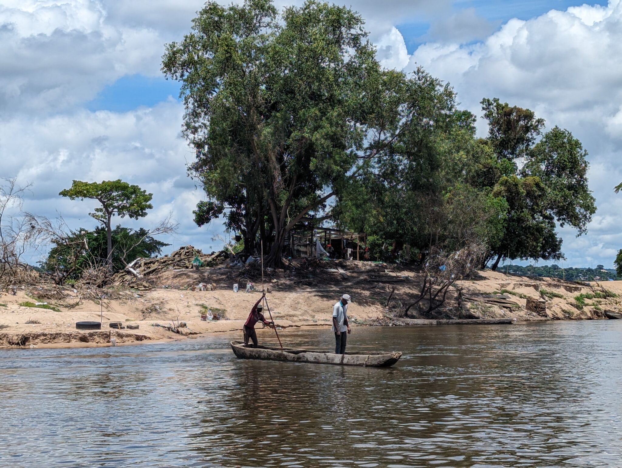 a group of people in a boat on a river
