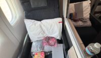 a chair with a pillow and a box on it
