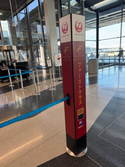 a red and black post with a blue tape