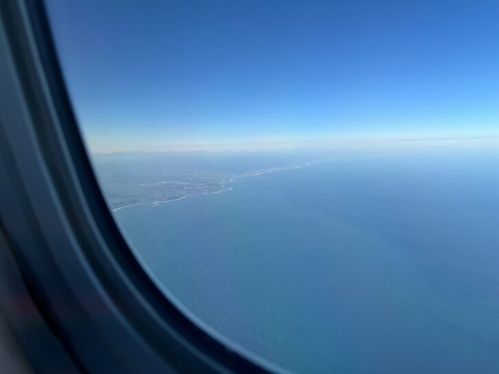 a view of the ocean from an airplane window