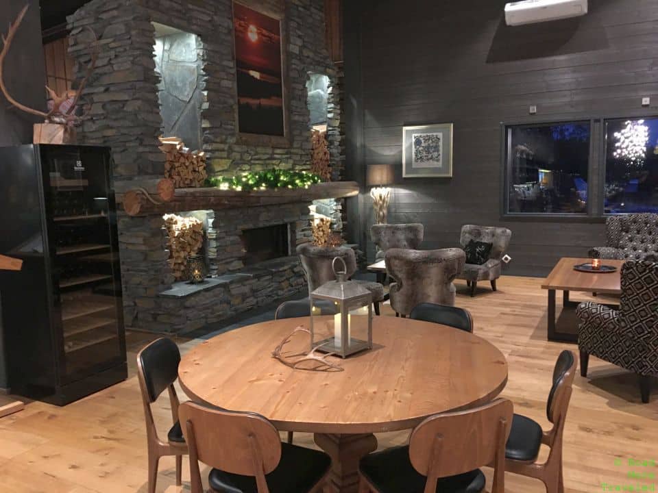 a room with a round table and chairs