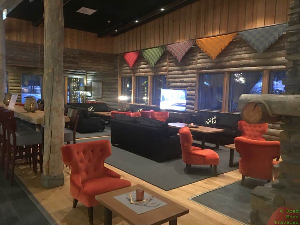 a room with a couch and chairs