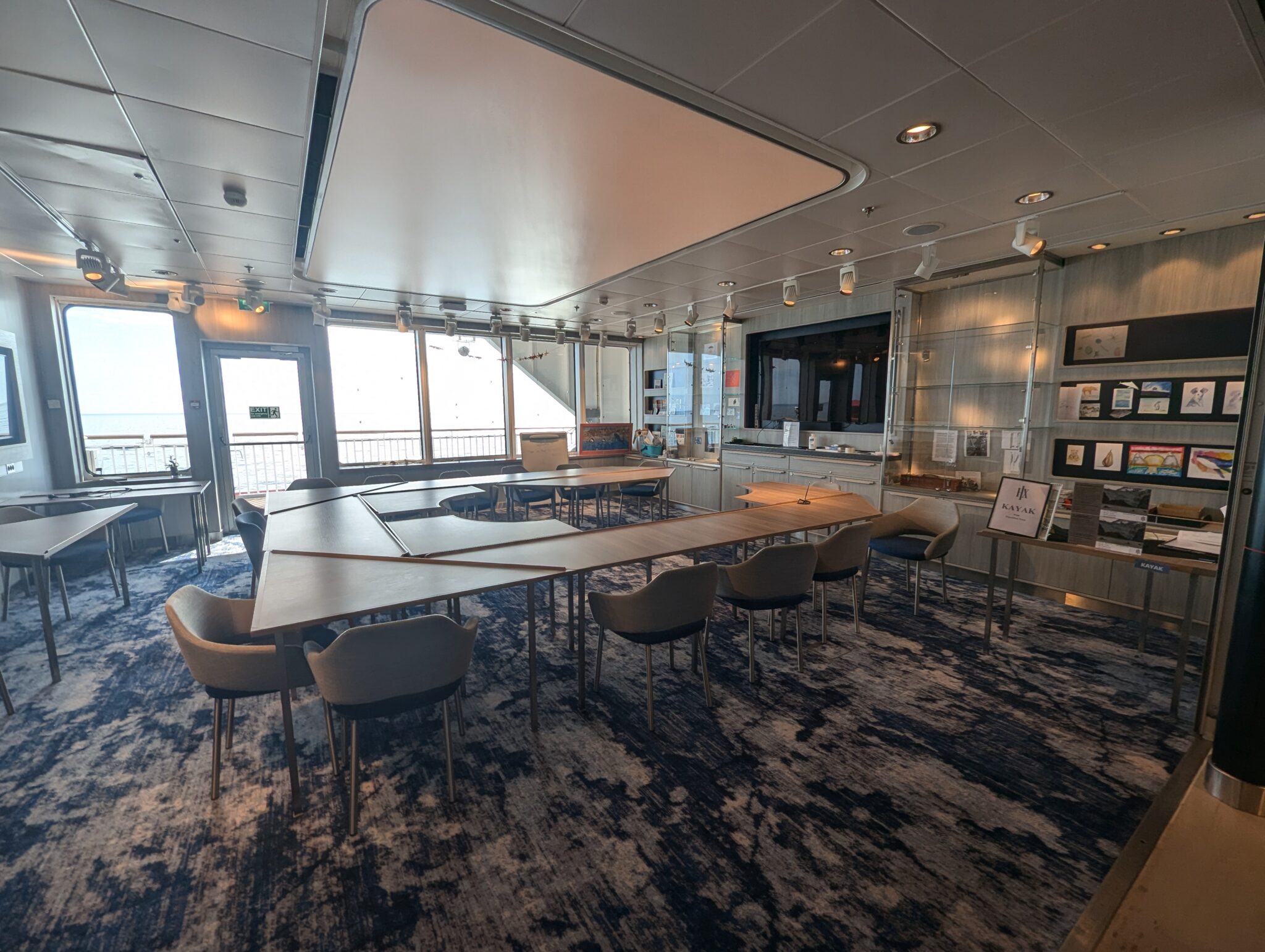 a room with a large table and chairs