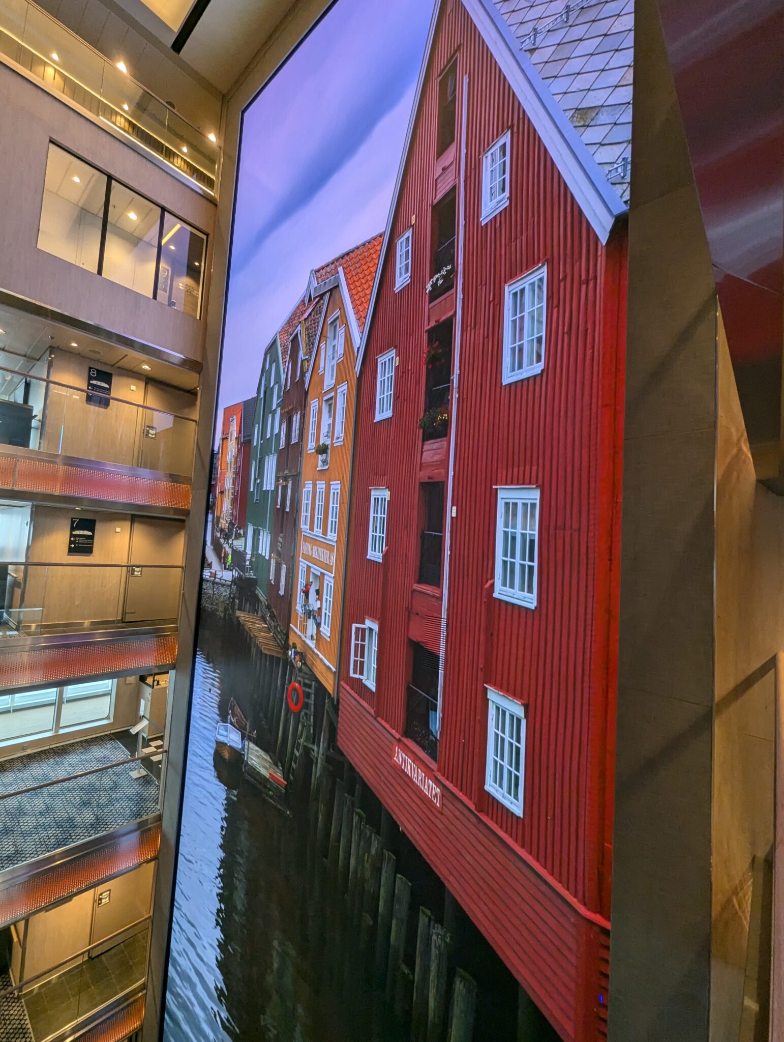 a large painting of a red building