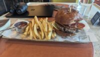 a burger and fries on a tray