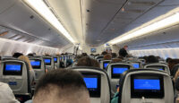 a group of people sitting in an airplane