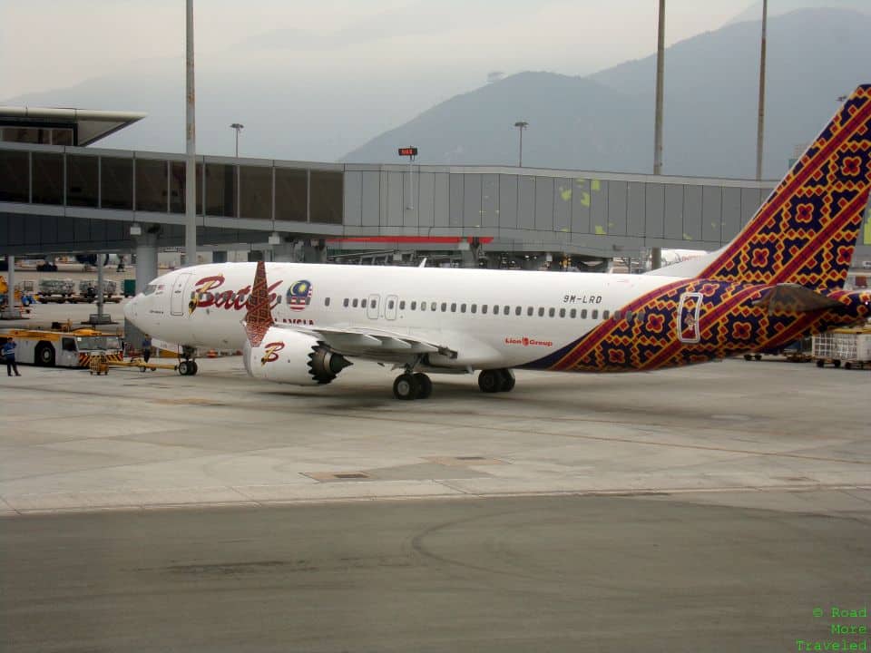 a white airplane with colorful design on it