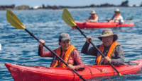 a group of people in a kayak