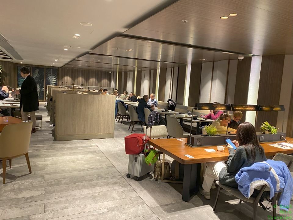 Plaza Premium Lounge HKG Gate 1 dining booths and tables