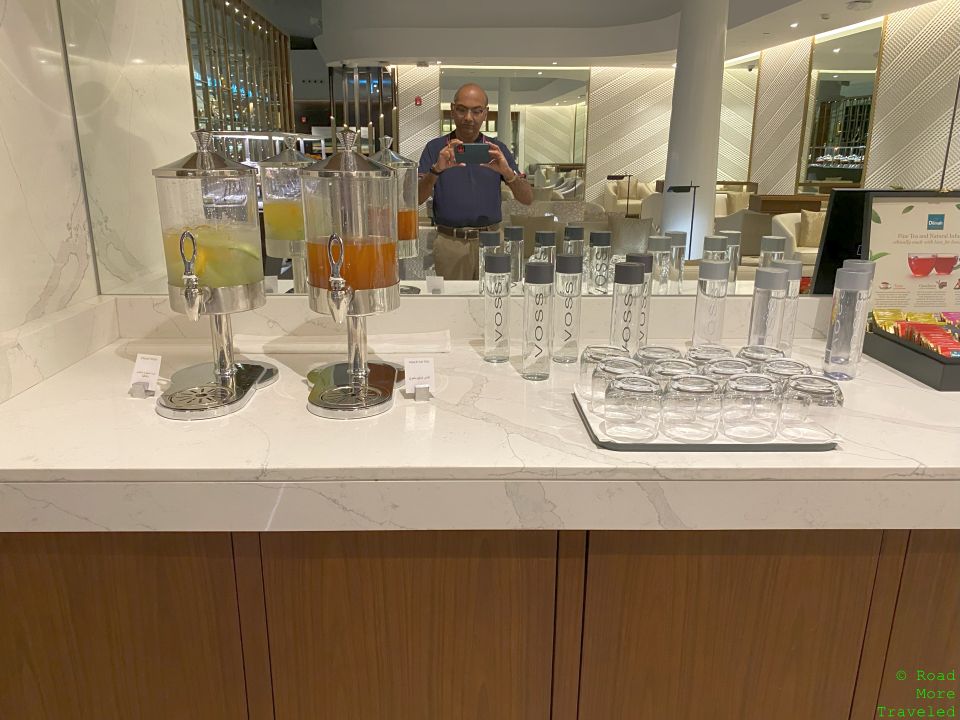 EY F Lounge AUH juice and water