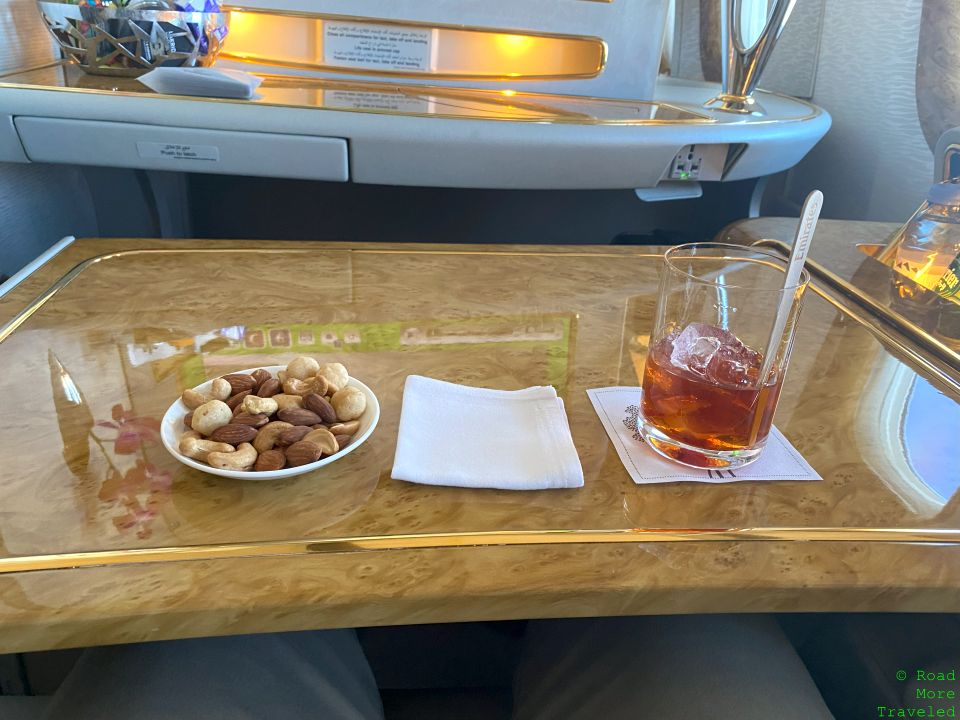Emirates B777-300ER First Class - mixed nuts and beverage