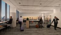 a group of people in a room with luggage