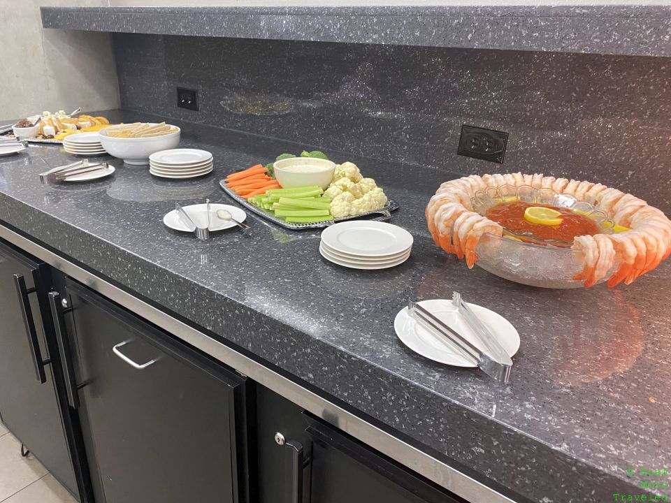 shrimp cocktail and vegetables on buffet