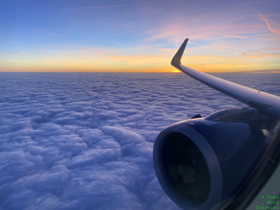 Airplane engine at sunset between GLA and LHR