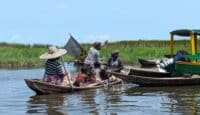 a group of people in boats on a river