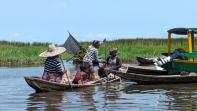a group of people in boats on a river