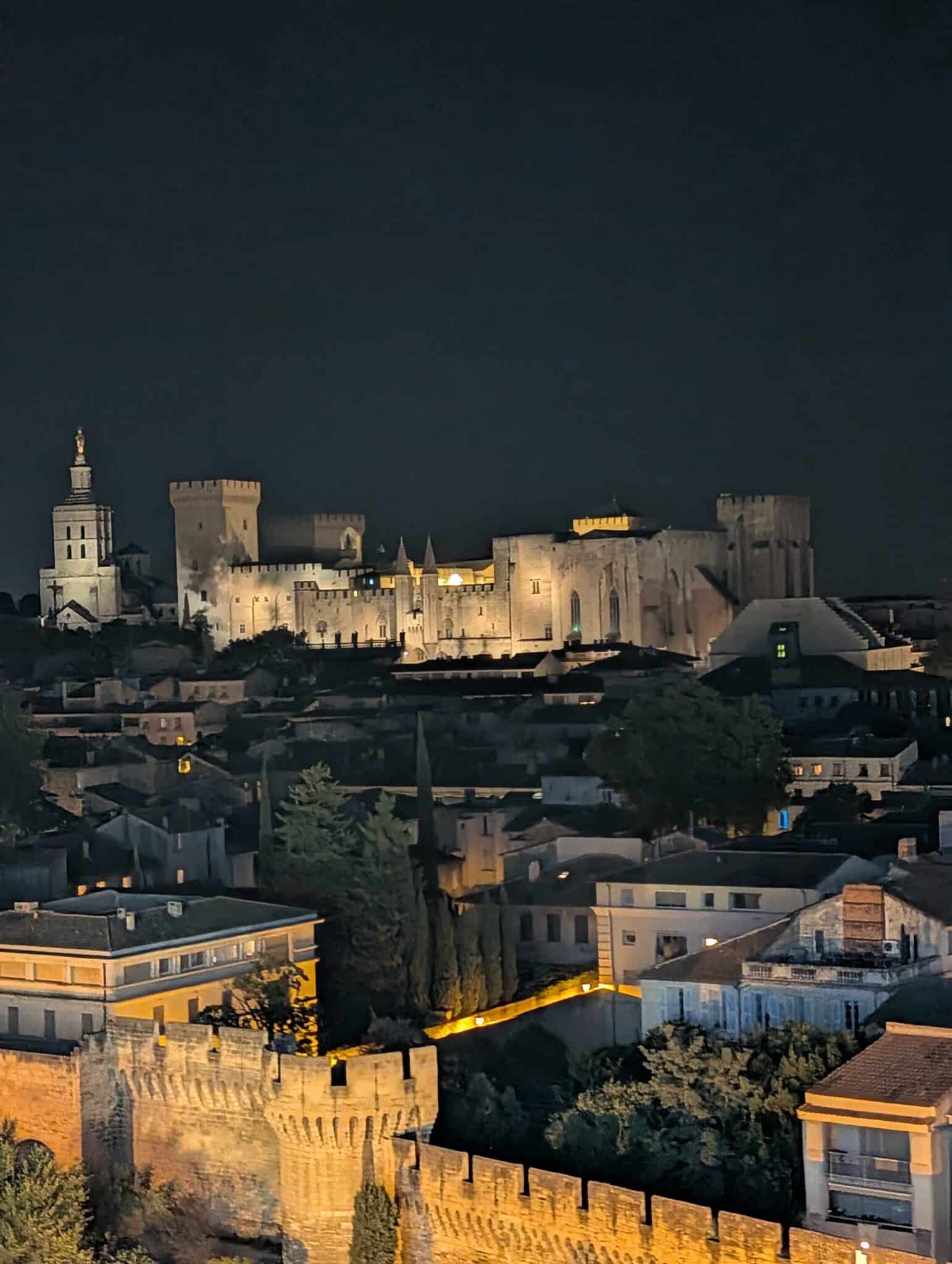 a castle in a city at night