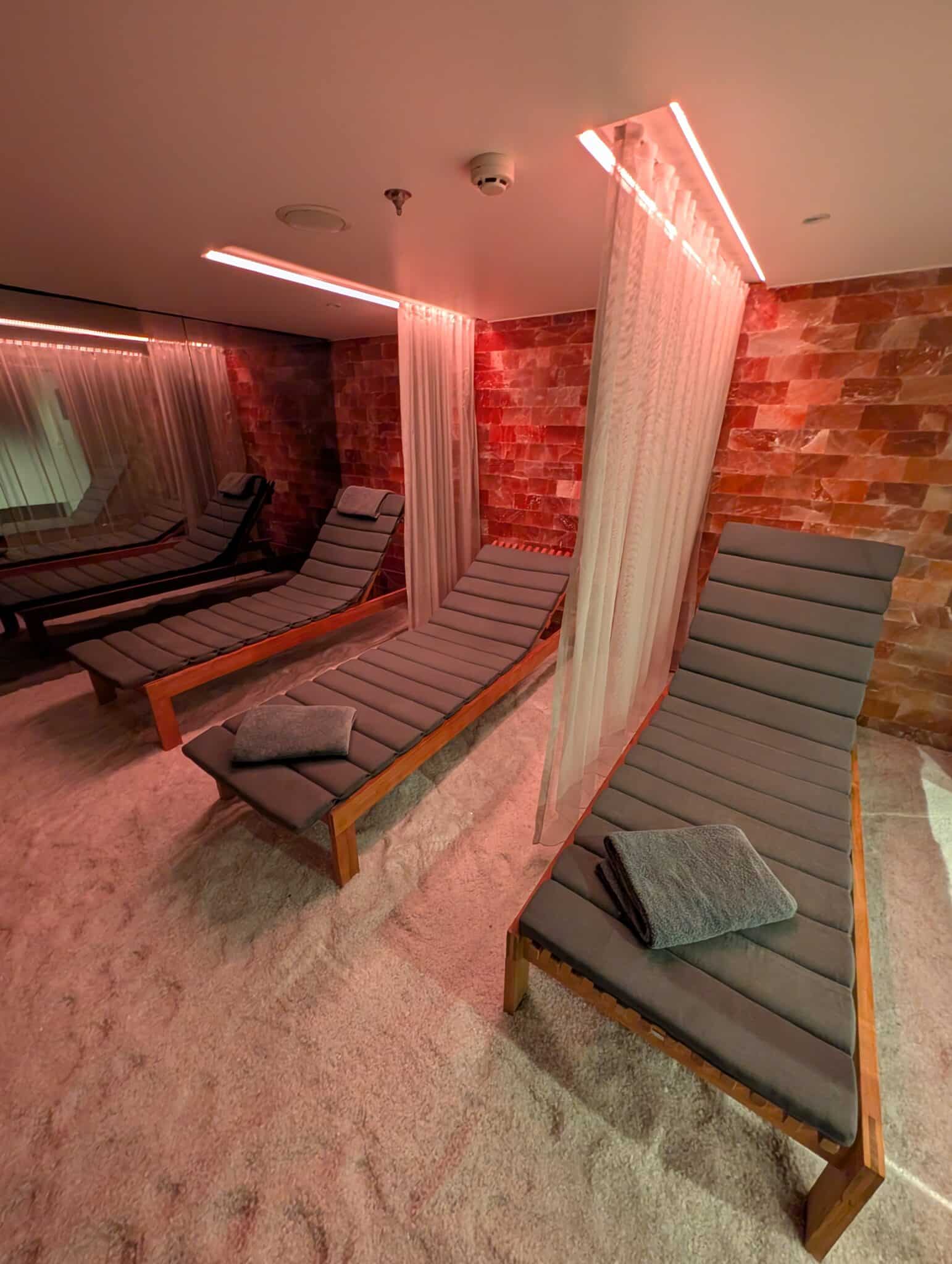 a group of lounge chairs in a room