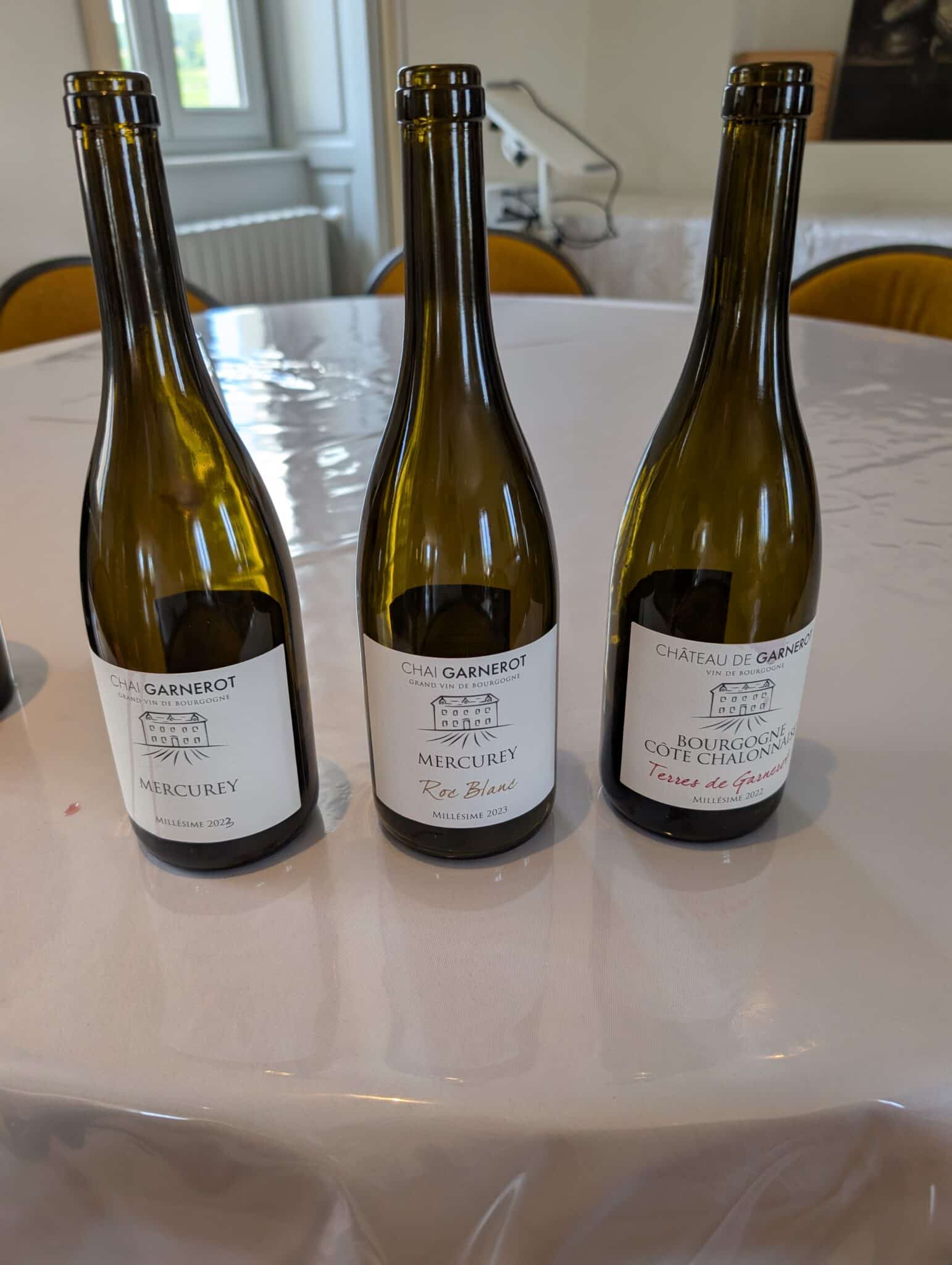 a group of wine bottles on a table
