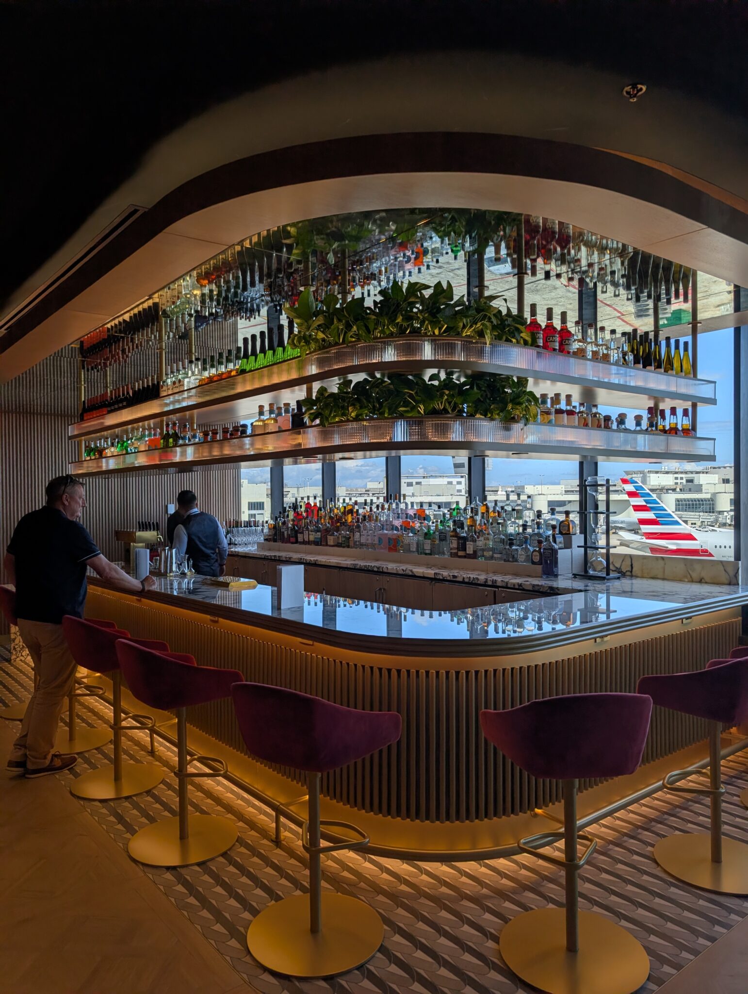 a man standing at a bar