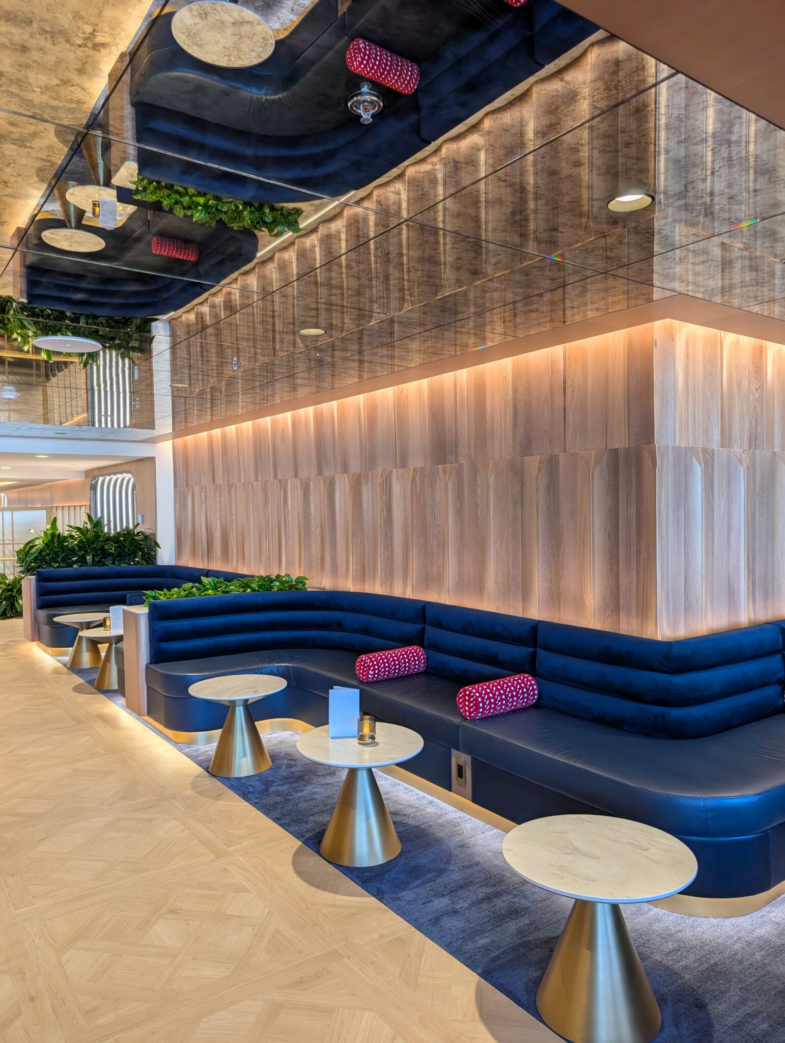 a room with a blue couch and tables