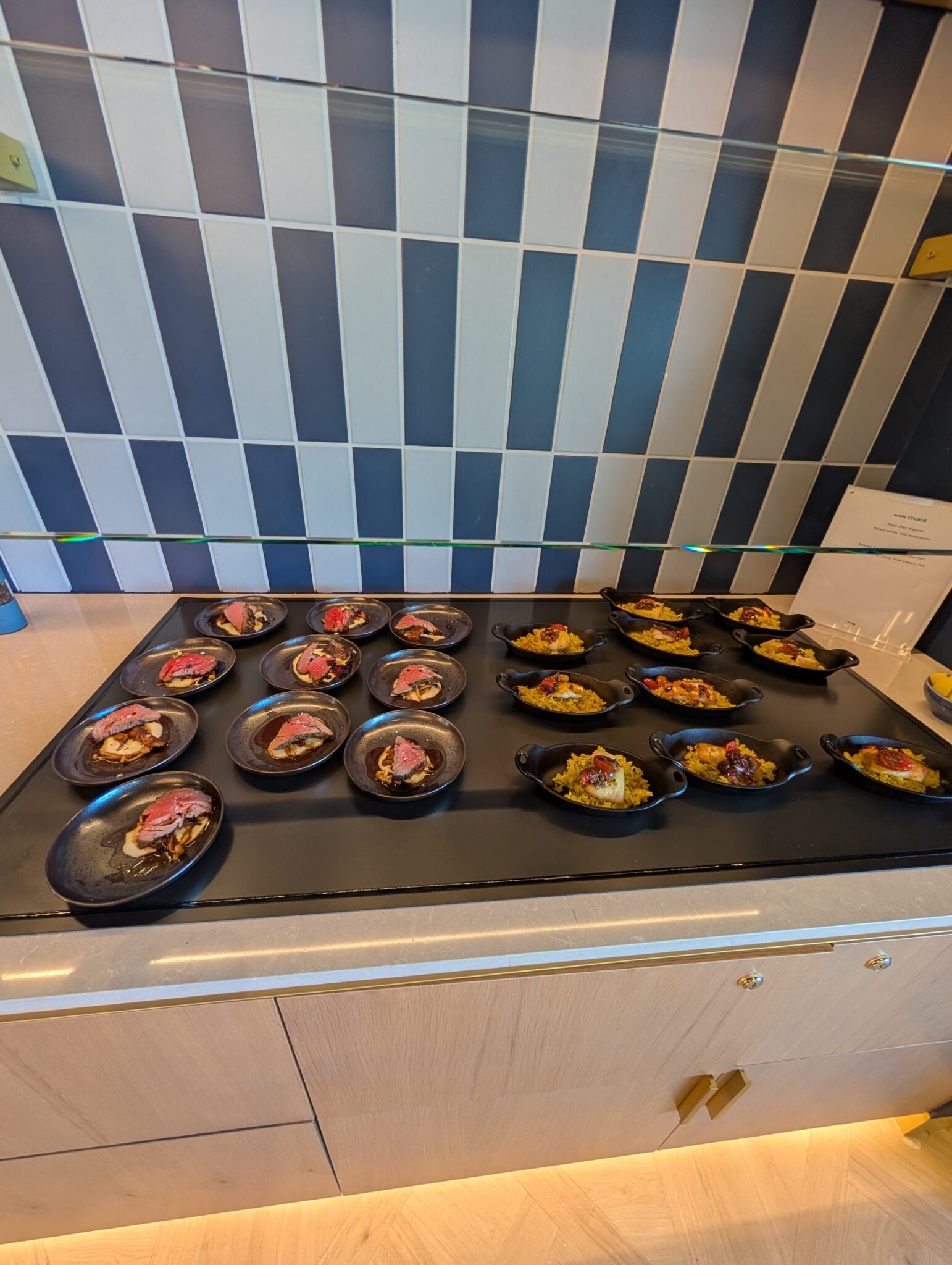 a group of plates of food on a counter