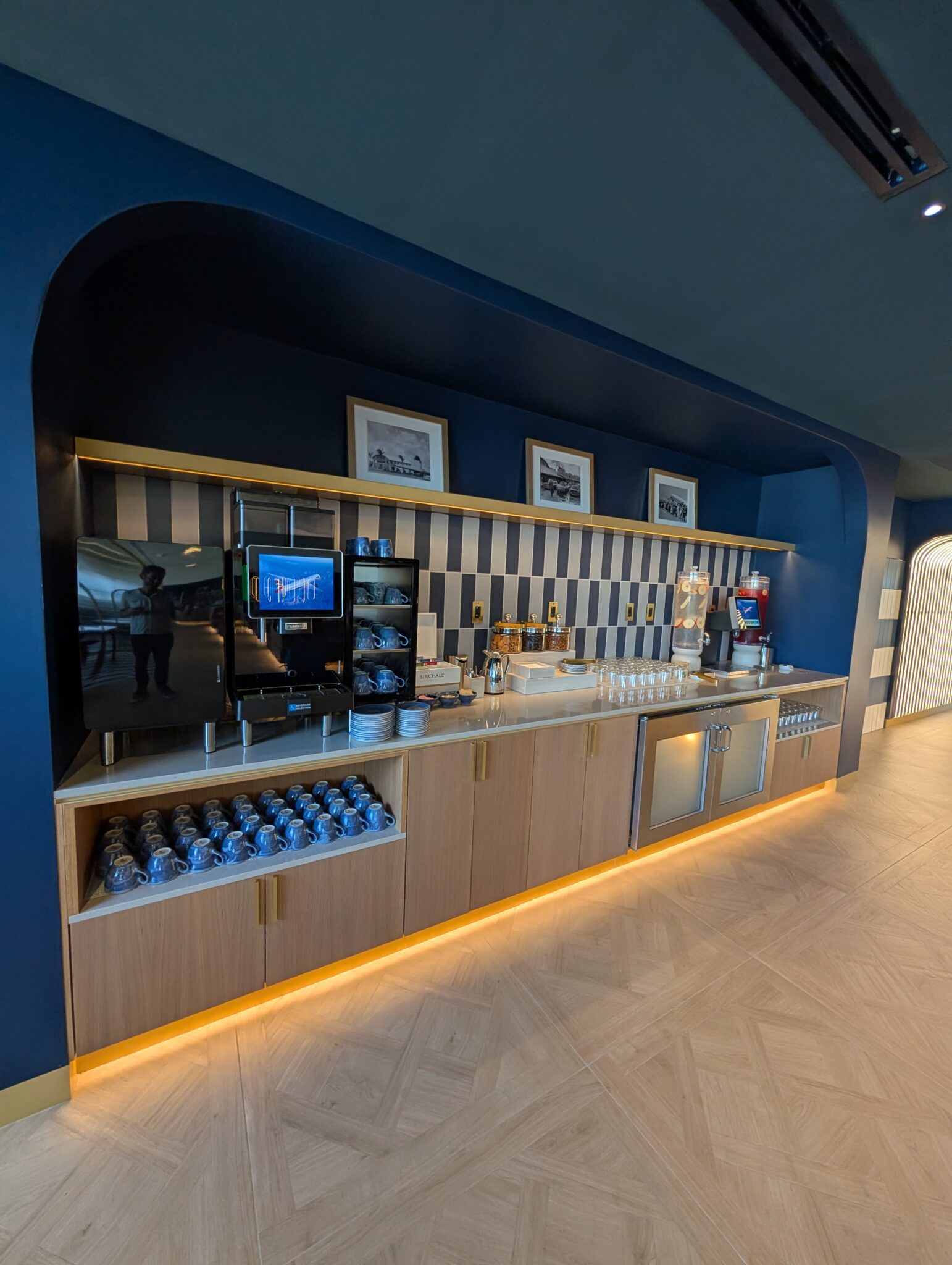 a room with a bar and a television