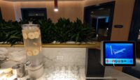 a counter with a machine and a drink dispenser