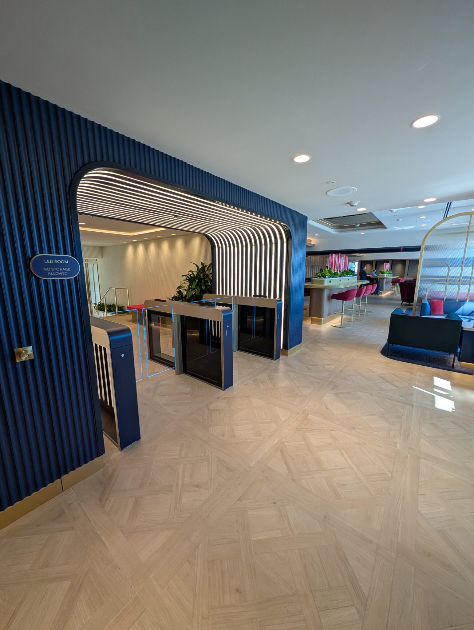 a lobby with a blue wall and a blue door