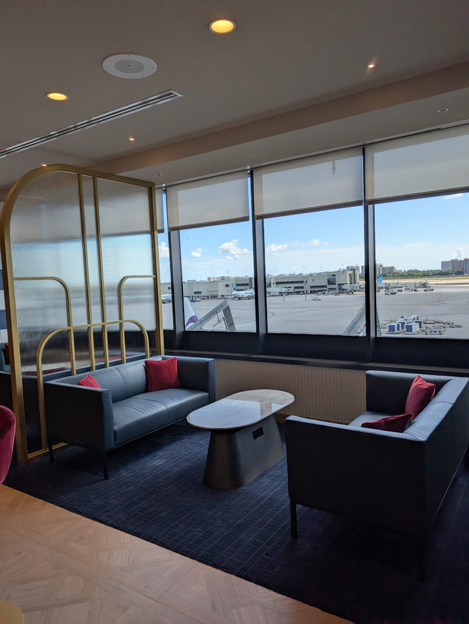 a room with a window and chairs and a table