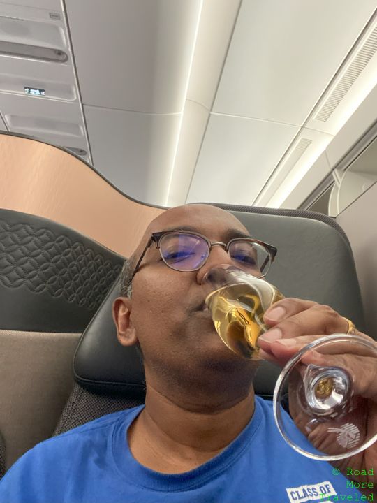 QSuites champagne selfie