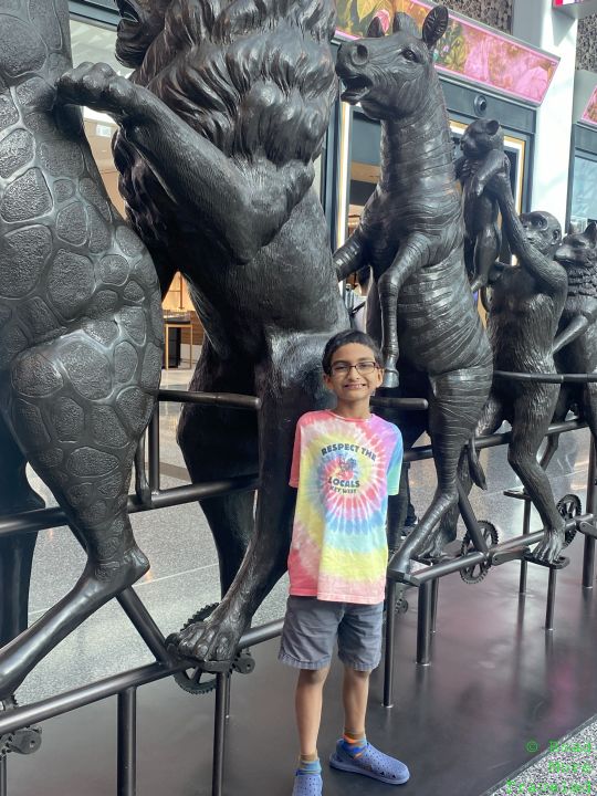 My son in front of horse sculpture at DOH