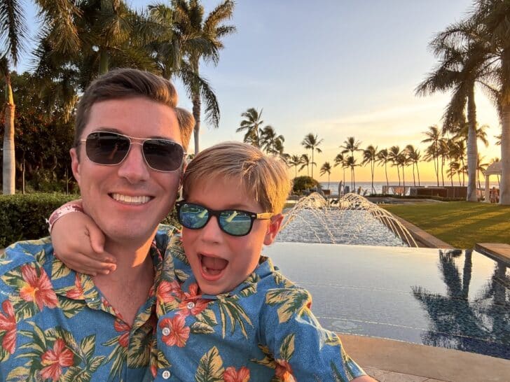 a man and boy taking a selfie