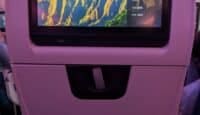a screen on an airplane seat