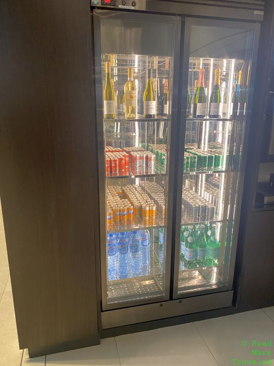 a refrigerator with bottles of beverages