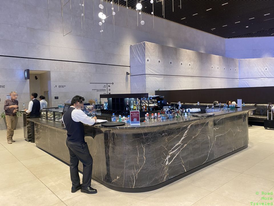 a man standing at a counter in a building