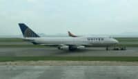 United Airlines 747-400 towed in Hong Kong