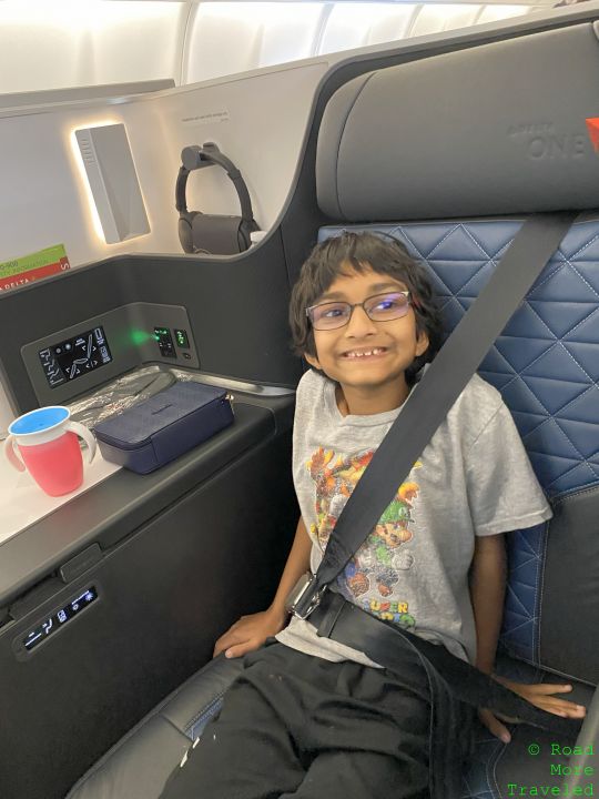 a boy sitting in a seat belt