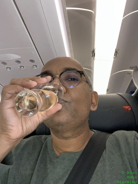 a man drinking from a glass