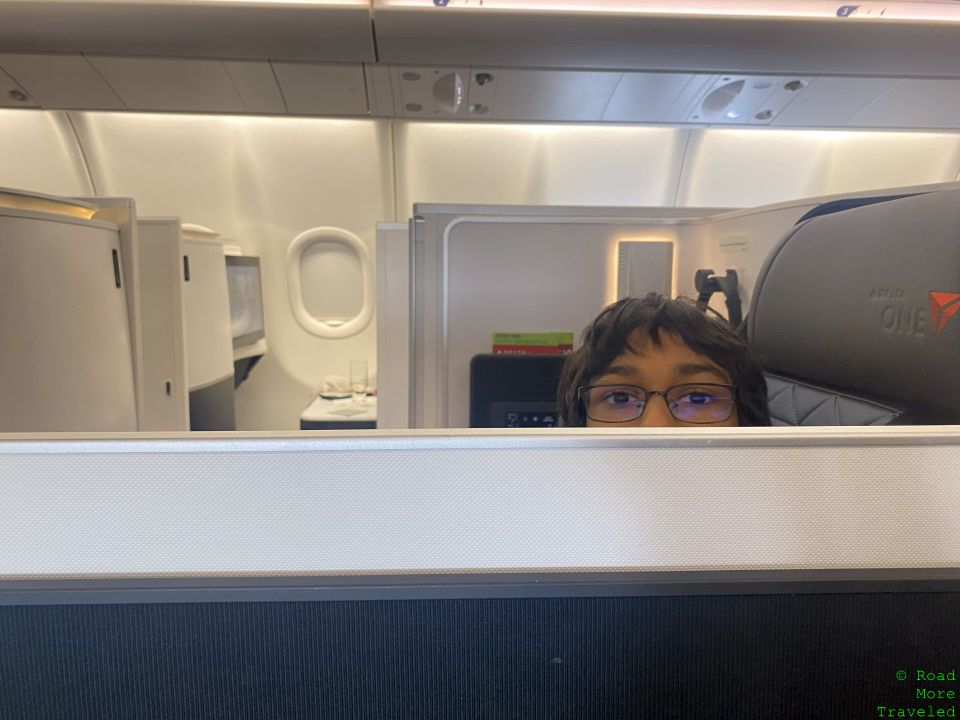 a boy sitting in an airplane