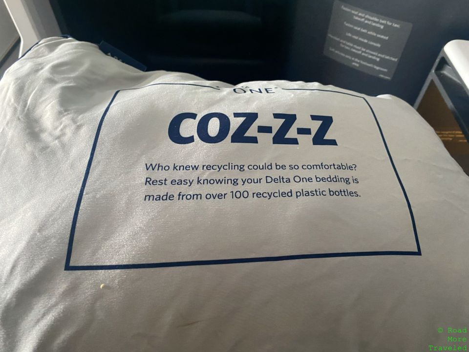a white pillow with blue text on it
